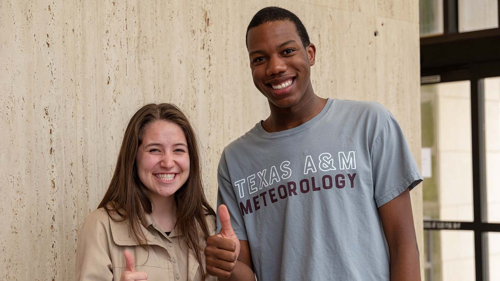 Two meteorology students smiling.