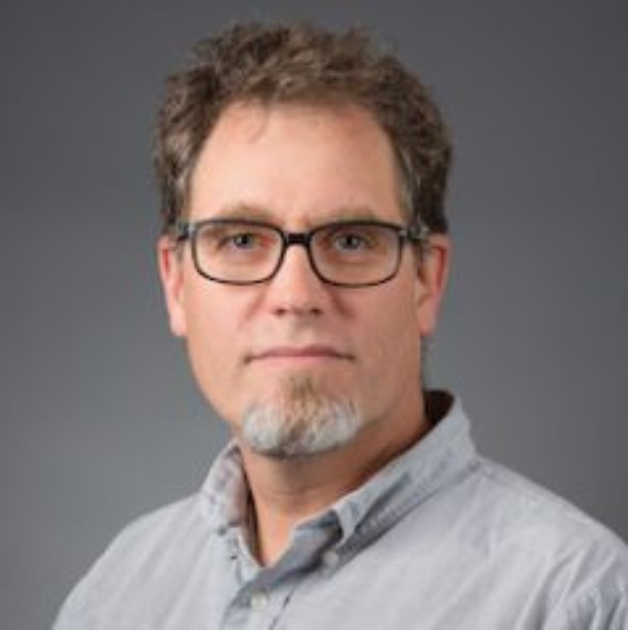 Headshot of Dr. David Daegling. Man with short hair wearing glasses and collared shirt.