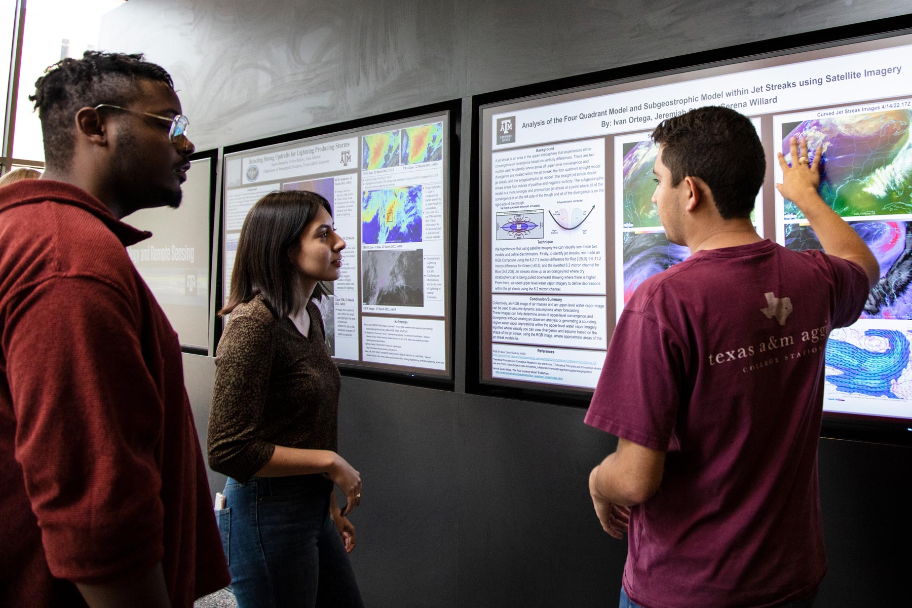Atmospheric science students presenting research posters