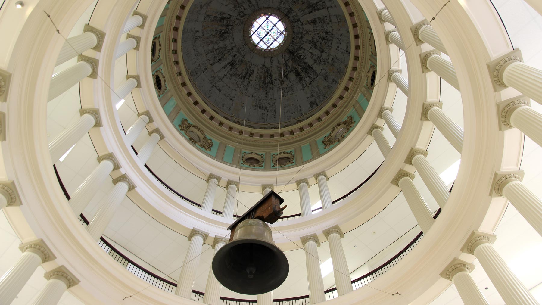 The liberty bell hanging inside the Academic Building