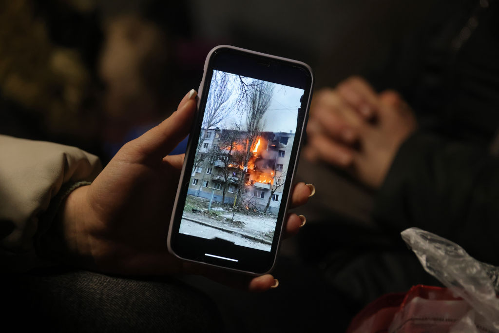 Picture of a building on fire on a phone 