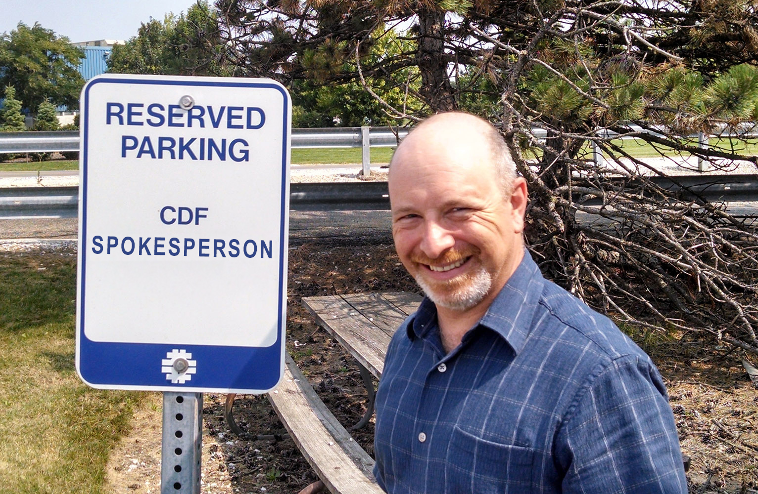 Dr. David Toback standing in front of a reserved parking sign for the CDF spokesperson