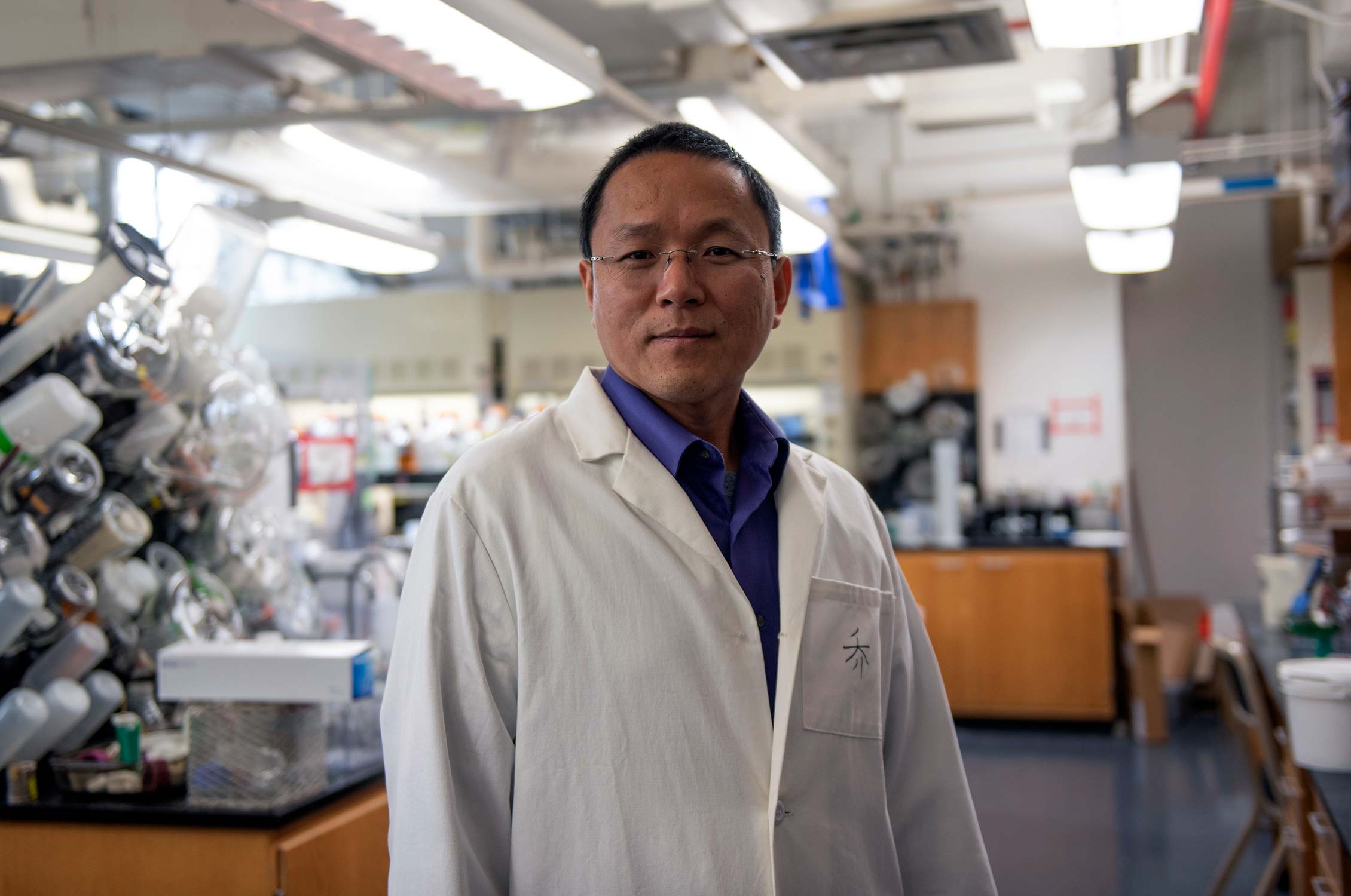 Texas A&M chemist Wenshe Ray Liu smiles at the camera in his lab