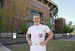 Nathan Kyle Drain stands before Kyle Field