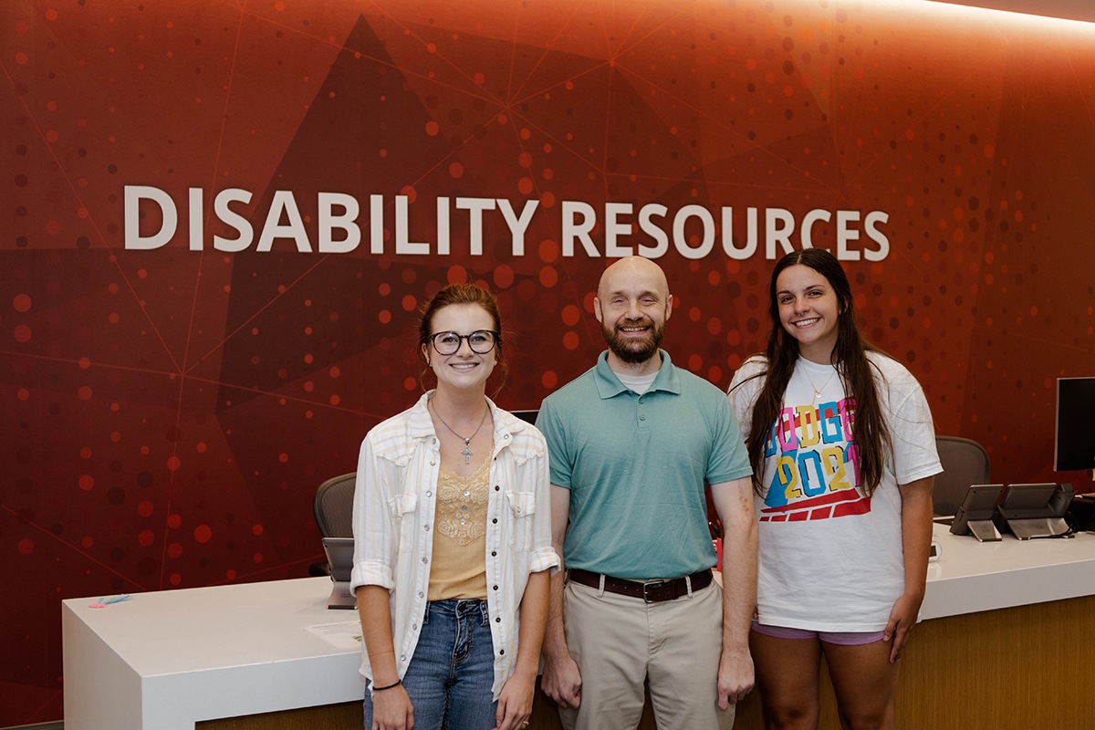 Disability Resources Assistant Director Justin Romack (center) with his student employees