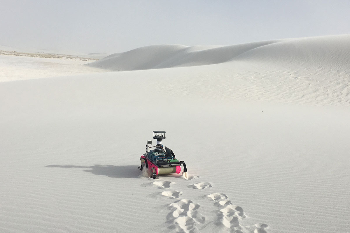 The legged robot navigating a planetary-analog landscape, in White Sands Dune Field in New Mexico. 