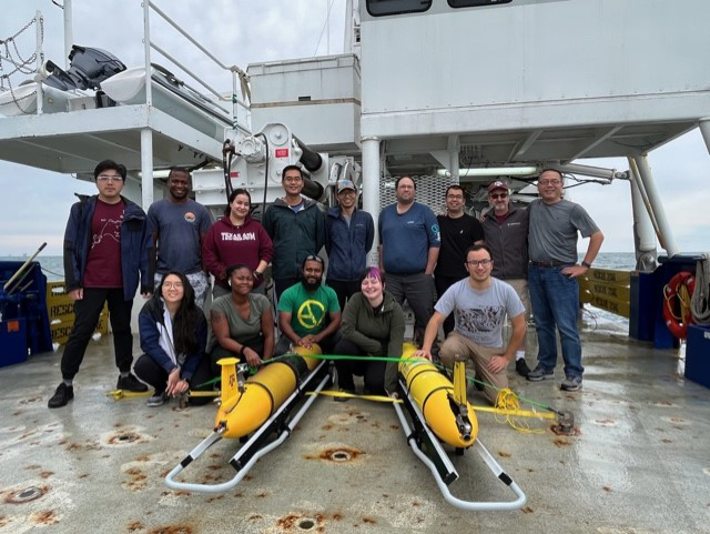 A group of researchers including Texas A&amp;M professor and chief scientist Steven DiMarco on the deck of the R/V Pelican with two Teledyne-Webb Slocum buoyancy gliders
