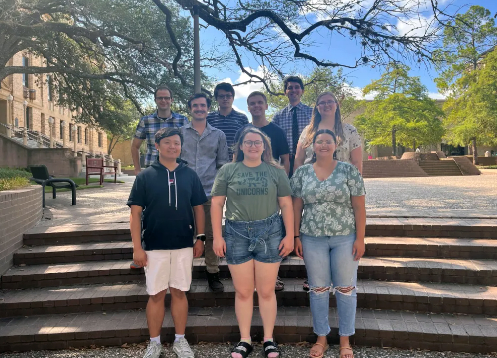 Texas A&amp;M chemist Daniel Tabor and his research group, pictured outside the Chemistry Building on the Texas A&amp;M University campus