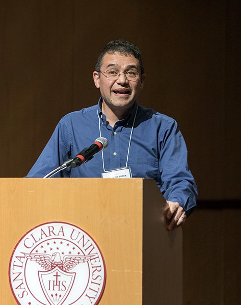 University of California, Davis, mathematician Dr. Jesús A. De Loera speaks to an audience about his research