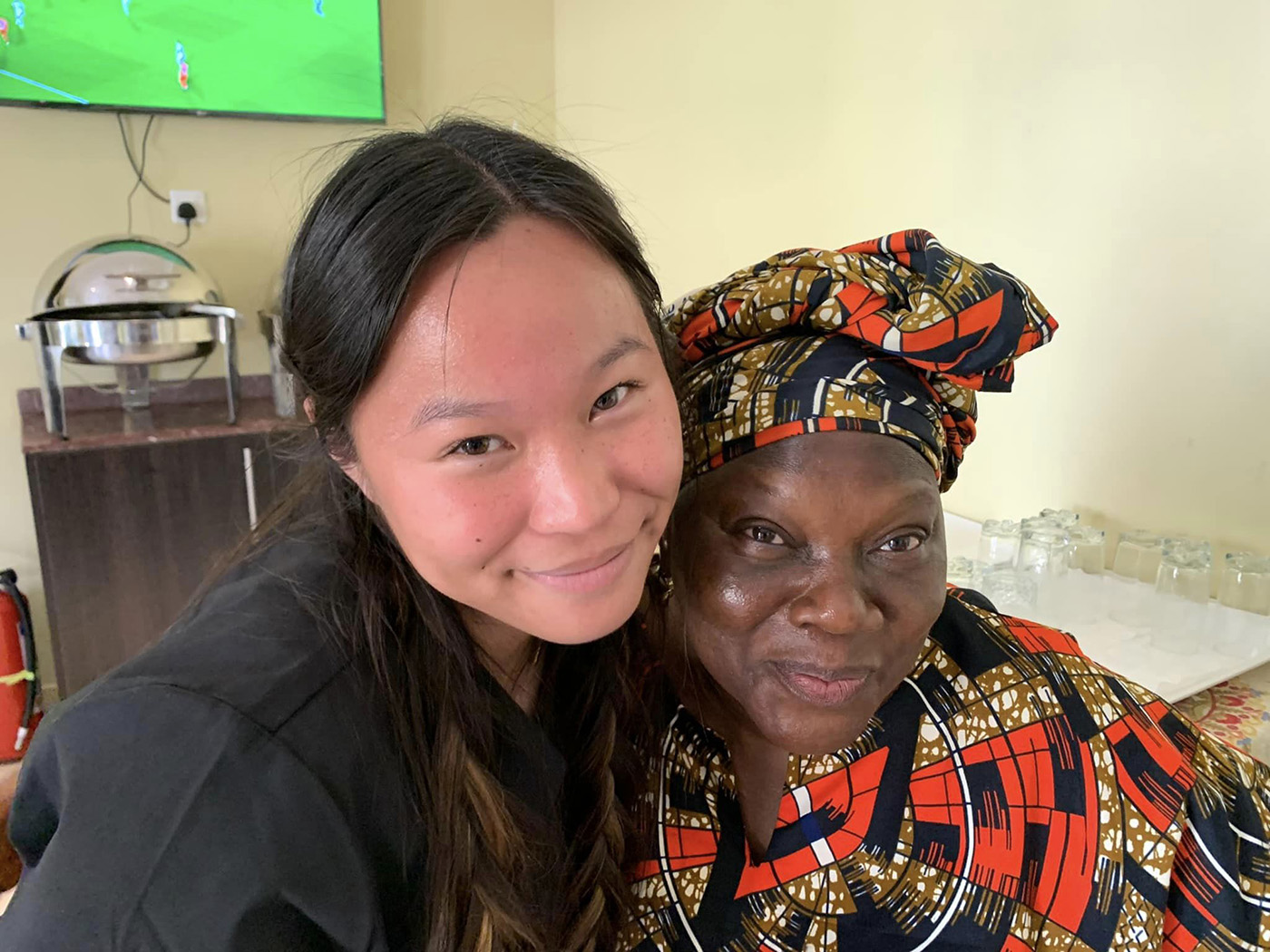 Texas A&amp;M biomedical sciences major Mya Phelps poses with the cook in Nigeria in May 2022
