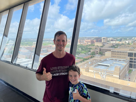 Texas A&amp;M former student Sam McGee and his son, Samuel, take in the view from the observation deck of the Eller Oceanography and Meteorology Building on the Texas A&amp;M University campus