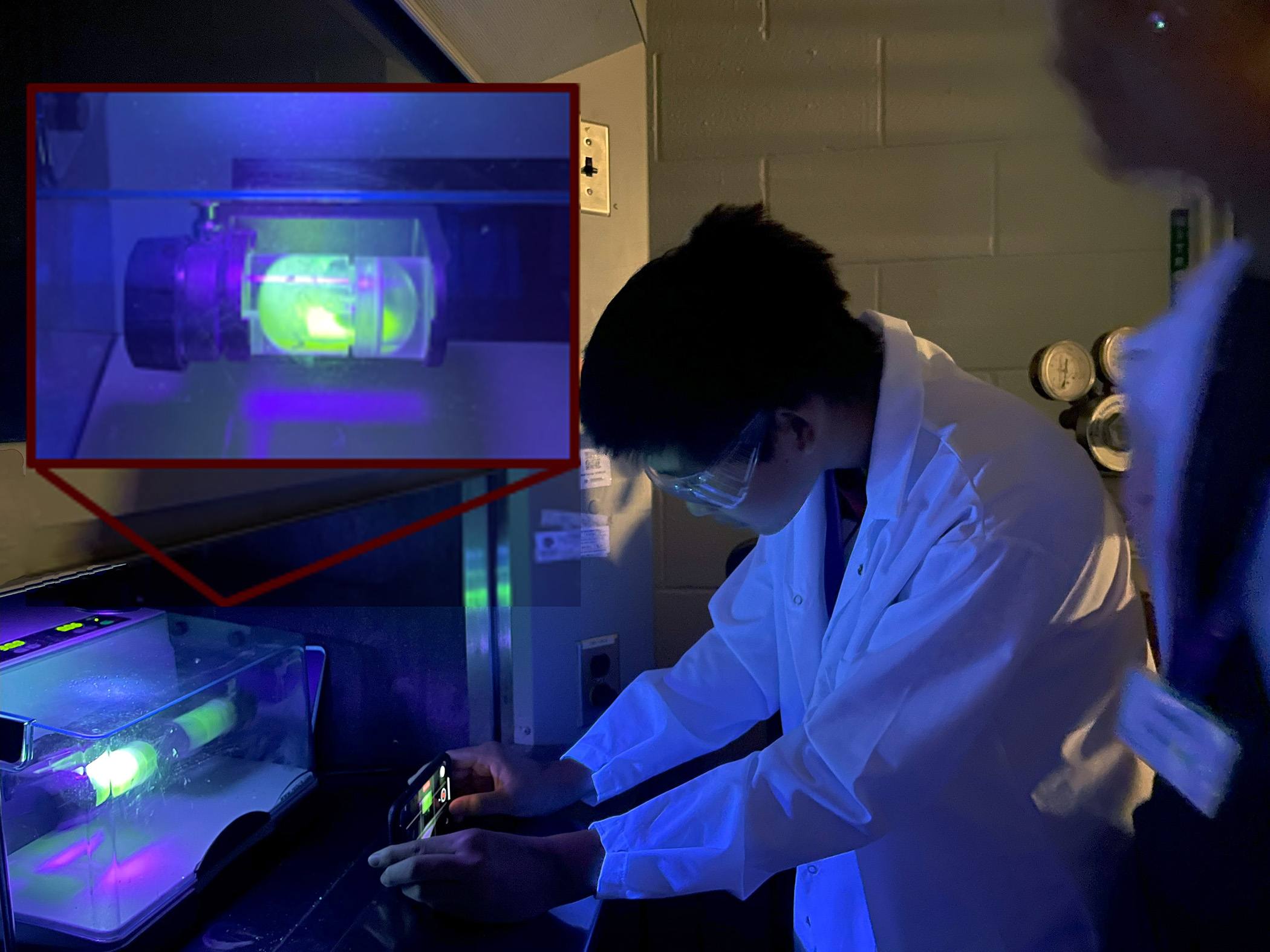 Composite image of students using a luminescent polymer to study how forces are distributed in a mechanochemical reactor, a close-up of which is included as an insert at top left of frame