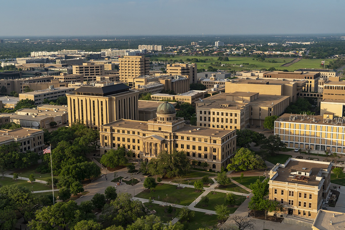 Aerial view of the Texas A&amp;M University campus featuring the Academic Building as its central focus