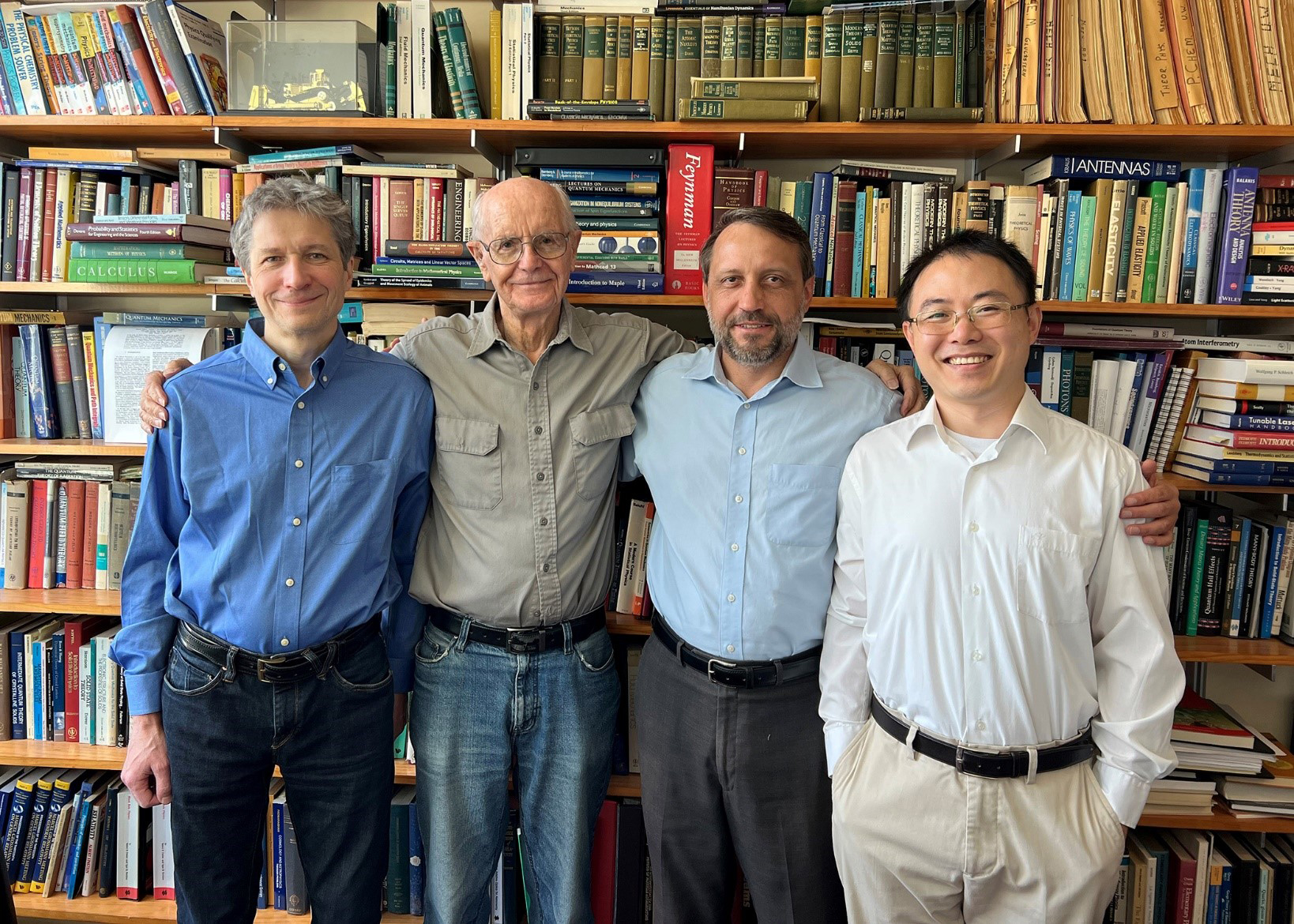 Texas A&amp;M University physicists (from left) Dr. Aleksei Zheltikov, Dr. Marlan Scully, Dr. Alexei Sokolov and Dr. Zhenhuan Yi pose in the Institute for Quantum Science and Engineering library on the Texas A&amp;M campus