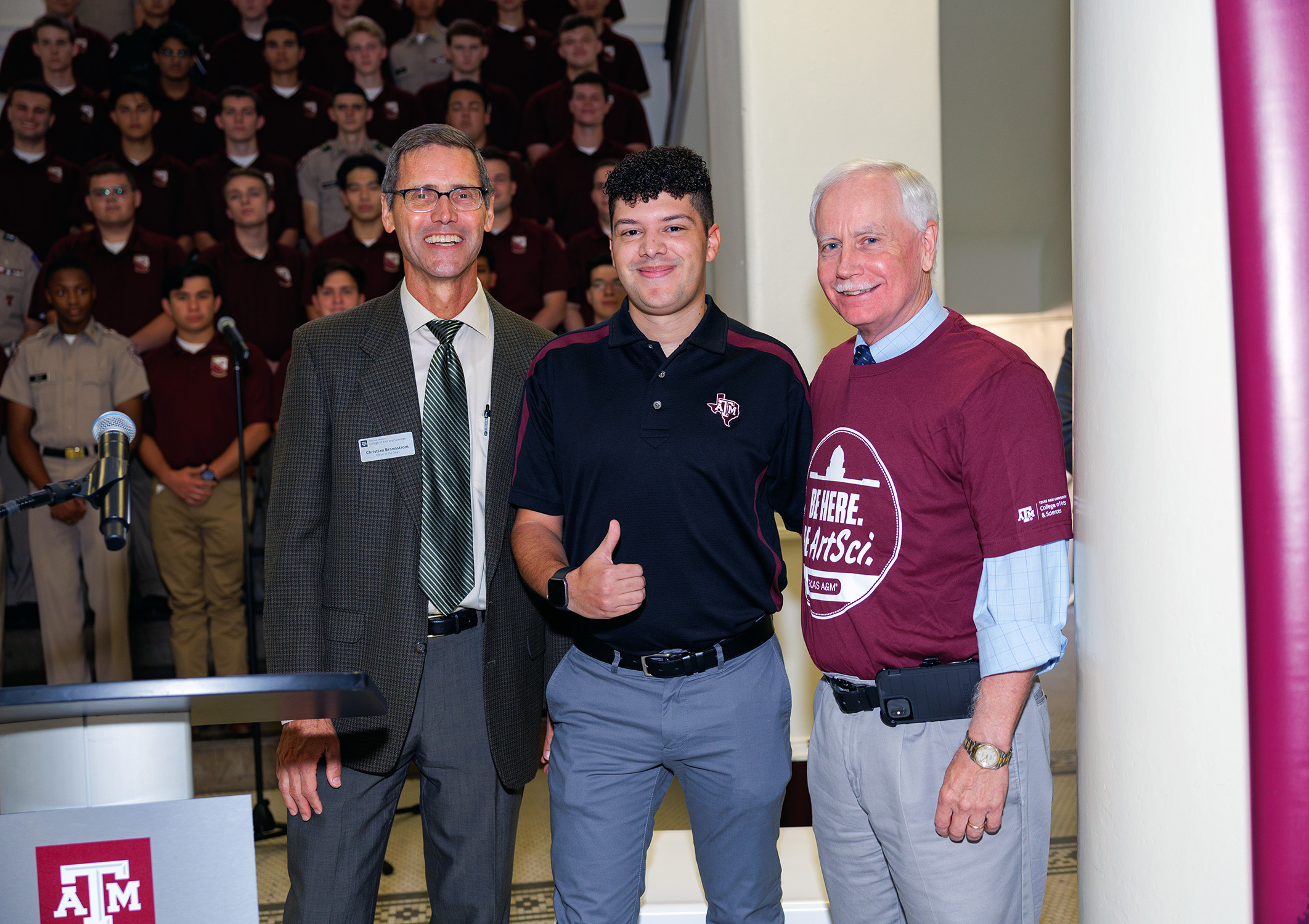 2020 Texas A&amp;M University sociology graduate Seth Crouch (center), flanked by Arts and Sciences Senior Associate Dean for Undergraduate Education Dr. Christian Brannstrom (left) and Interim Dean Dr. Mark Zoran (right) at the ArtSci Party at the Plaza event held on Nov. 4, 2023.