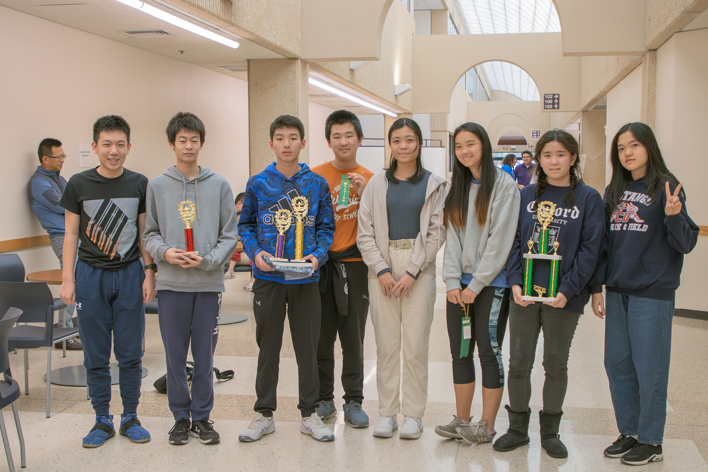 A group of students pose with their trophies and ribbons at the 2023 Texas A&amp;M High School Mathematics Contest