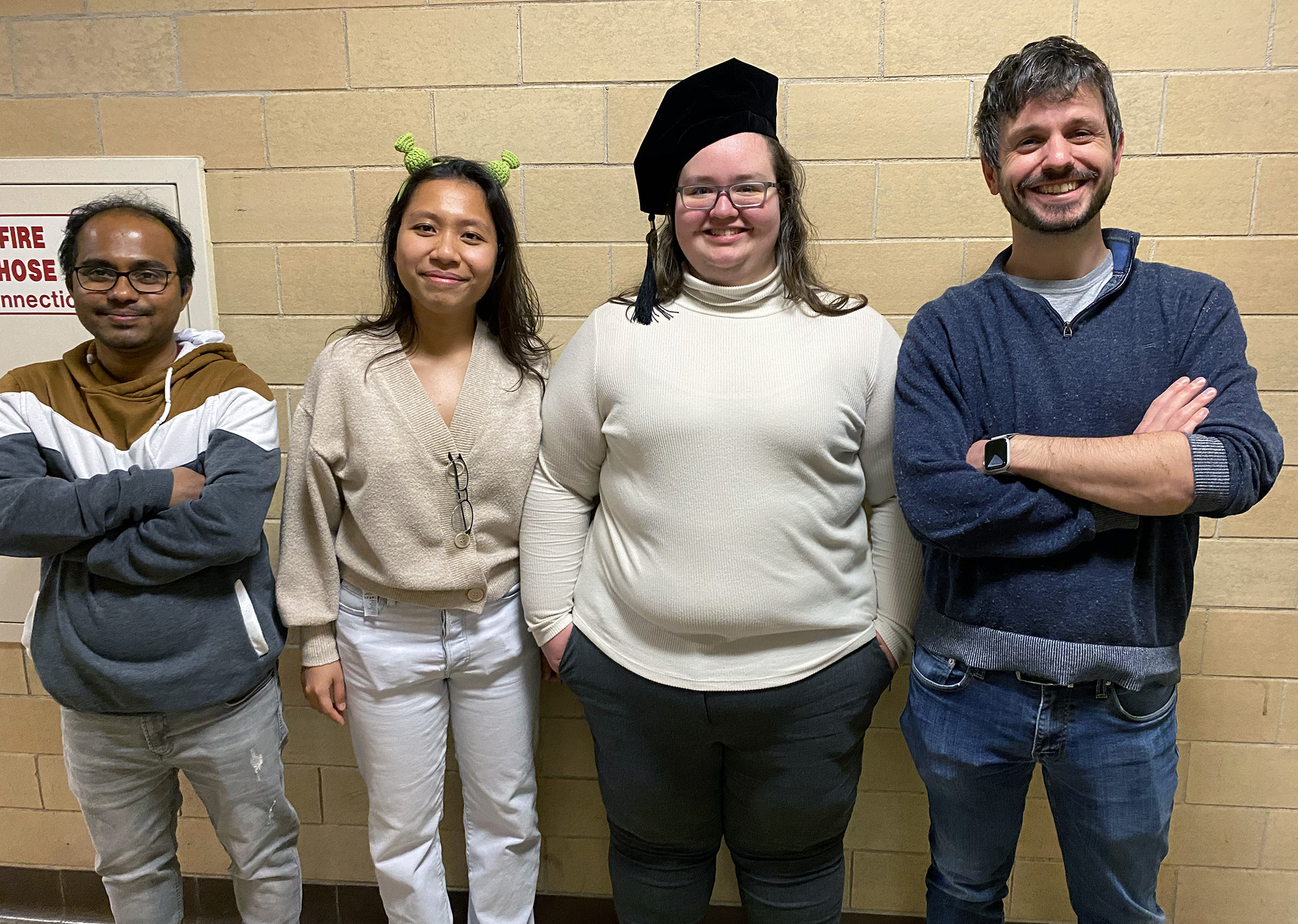 Texas A&amp;M University chemist Quentin Michaudel (right), pictured with Michaudel Laboratory members (from left) Arunava Maity, An Tran and Sarah Hancock at Hancock's doctoral commencement on Dec. 15, 2023.