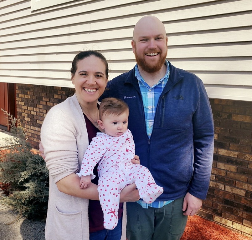 Dr. Ethan Nelson'12 (right) and Dr. Laura Lins Nelson with their daughter Eleanor last November.