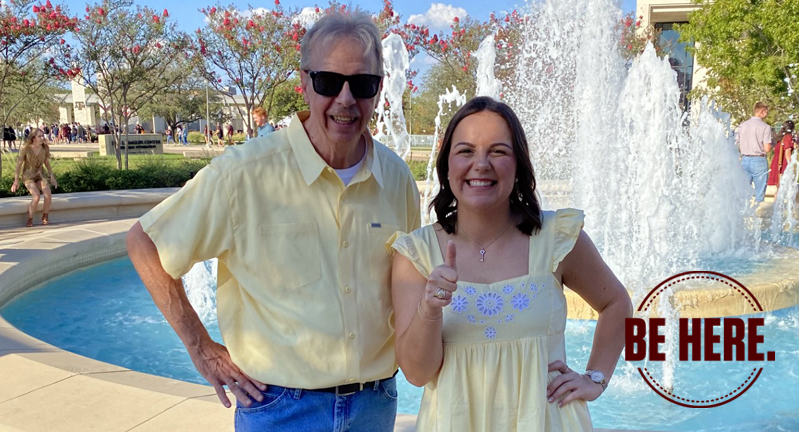 Texas A&M geography senior Mackenzie Portie poses with her grandfather Michael Hoover beside the water fountain outside the Jon L. Hagler Center after receiving her Aggie Ring
