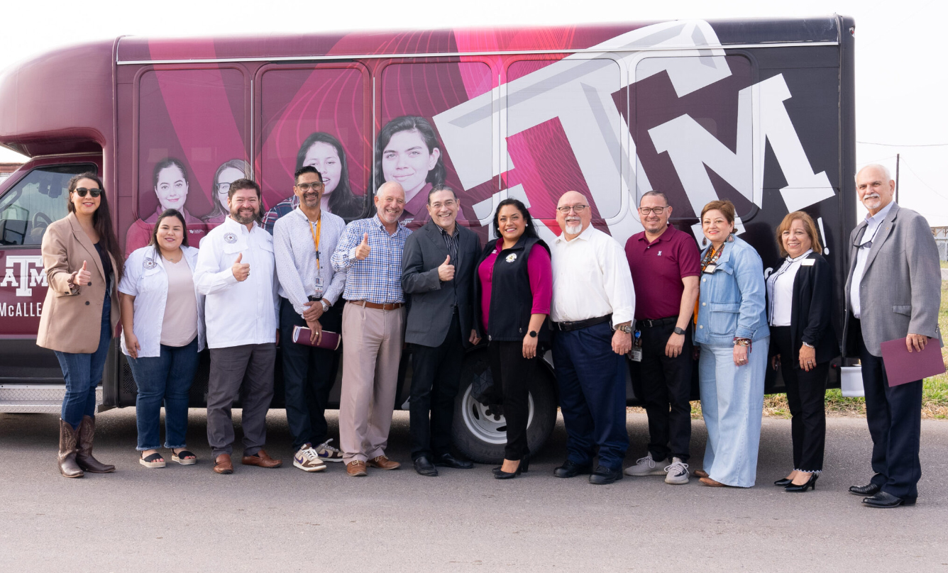 U.S. Census Bureau Director Robert Santos, pictured with a group of Texas A&amp;M University Higher Education Center at McAllen staff and area officials in front of a Texas A&amp;M-McAllen branded van