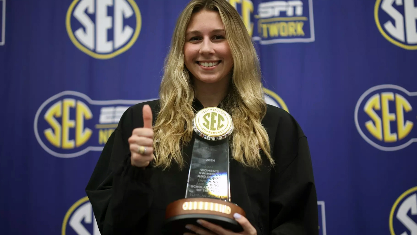 Texas A&M University swimmer Chloe Stepanek poses with her trophy recognizing her as 2024 Southeastern Conference Women's Swimming & Diving Scholar-Athlete of the Year