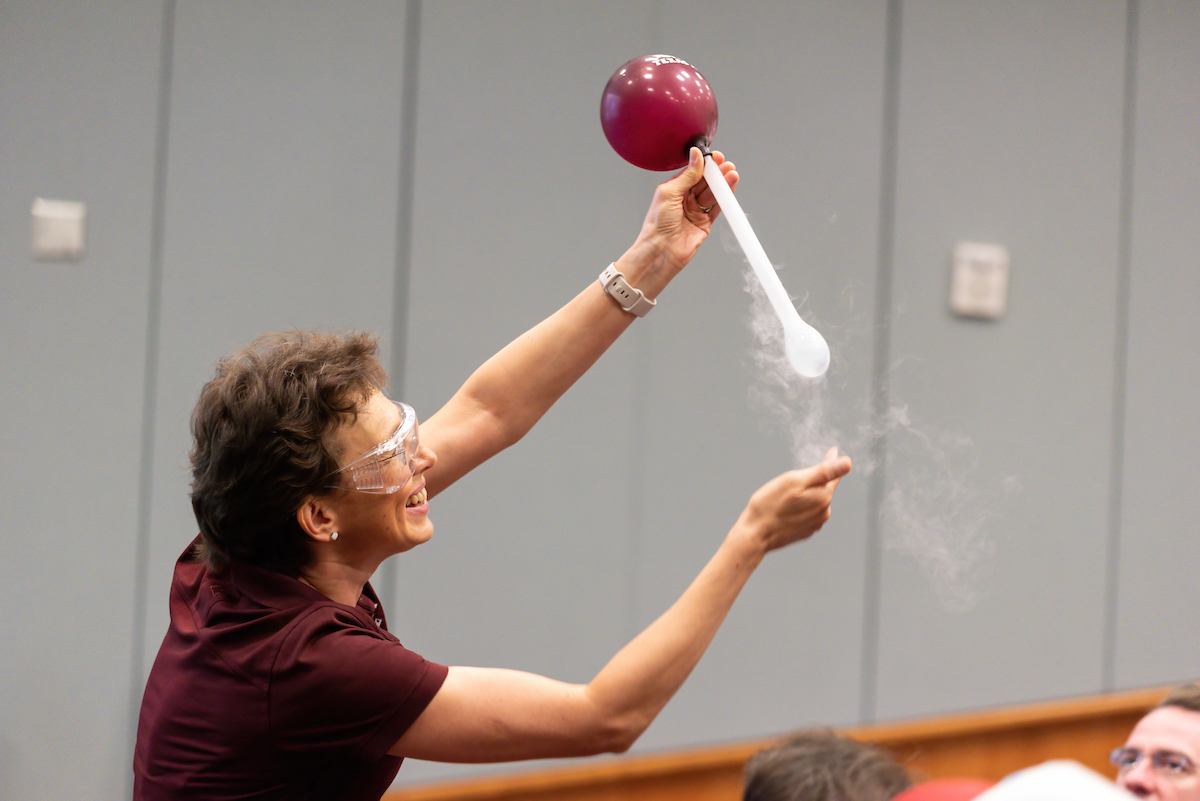 Texas A&amp;M physicist Tatiana Erukhimova shows the effect of liquid nitrogen on a balloon during the 2023 Mitchell Institute Physics Enhancement Program for high school physics teachers