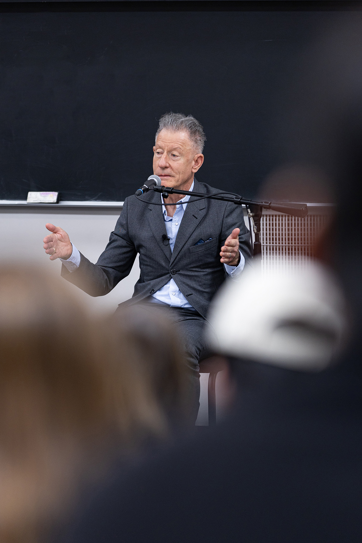 1979 Texas A&amp;M University graduate Lyle Lovett sits at the front of a classroom while speaking to a class full of undergraduates at Texas A&amp;M on Feb. 12, 2024
