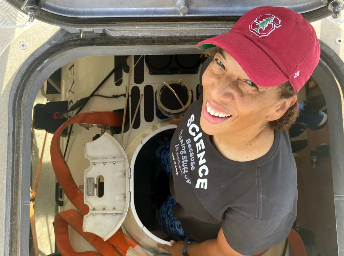 Texas A&amp;M University oceanography former student Dawn Wright smiles while climbing out of the hatch of the submersible "The Limiting Factor"