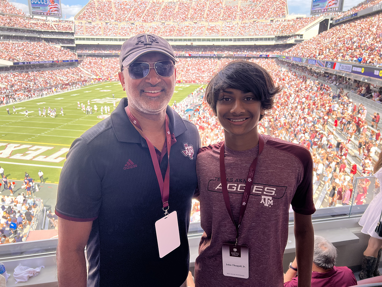 Dr. Thoppil and his son at the Texas A&amp;M vs. Auburn football game on September 23, 2023.