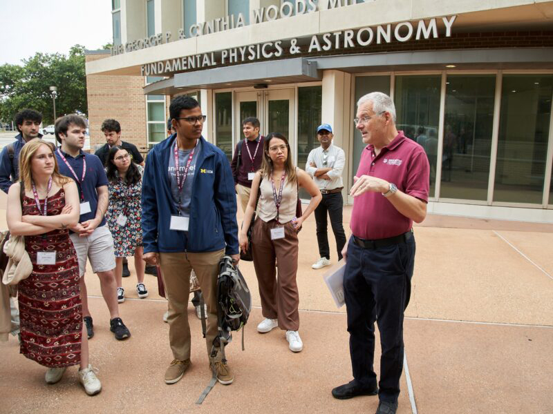 Texas A&amp;M University professor Joerg Steiner talks with students outside the George P. and Cynthia Woods Mitchell Institute for Fundamental Physics and Astronomy who are participating in the Lindau Nobel Laureate Meetings during a campus tour