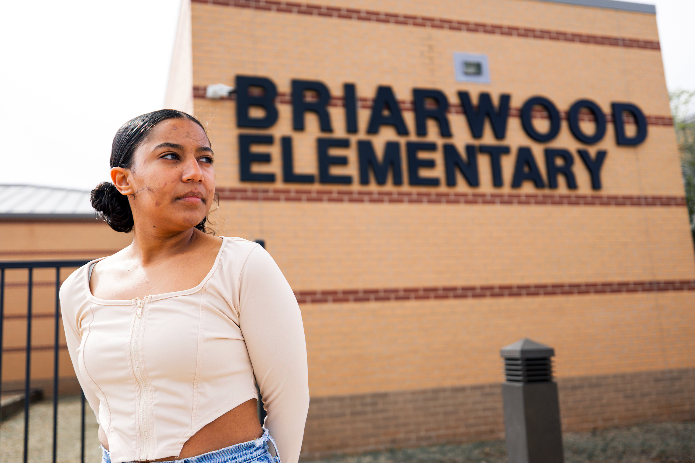 Aria Vargyas stands outside a rebuilt Briarwood Elementary School in her hometown of Moore, Oklahoma, on March 30, 2024