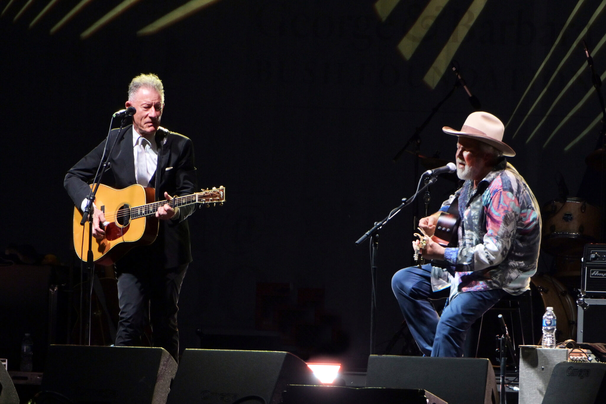 Texas A&amp;M University former students and musicians Lyle Lovett and Robert Earl Keen perform on stage on the grounds of the George H.W. Bush Presidential Library and Museum during the Bush 41@100 Centennial Celebration on June 13, 2024