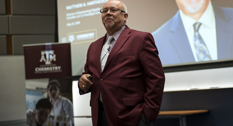 1982 Texas A&M University chemistry graduate Matthew Harthcock presents to a graduate student crowd on the Texas A&M campus