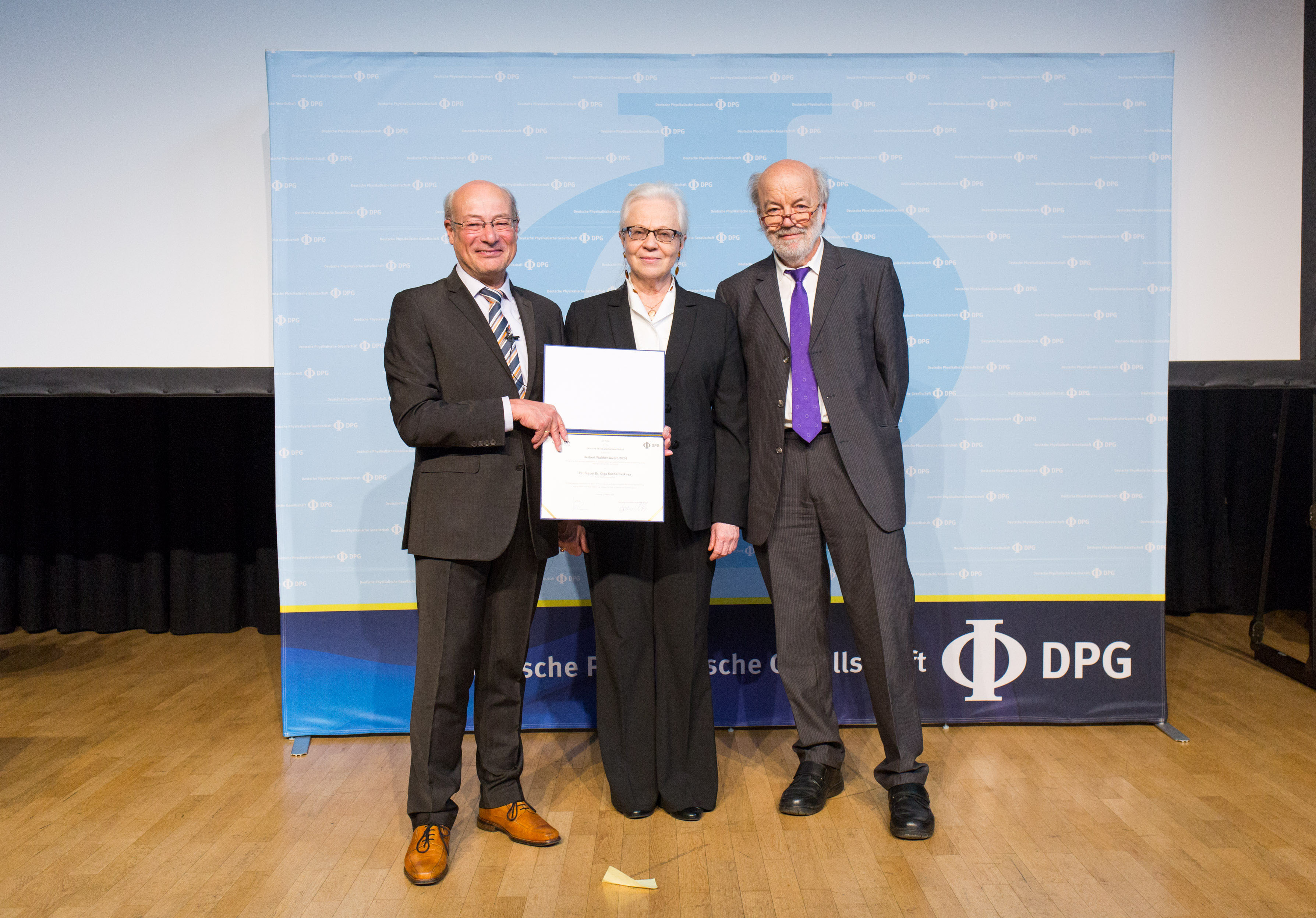 Texas A&amp;M University physicist Olga Kocharovskaya (center) accepts her 2024 Herbert Walther Award honoring pioneering research and leadership from German Physical Society President Jochim Ullrich (left) and Optica President Gerd Leuchs (right) during the German Physical Society meeting in Freiburg, Germany, this past March.