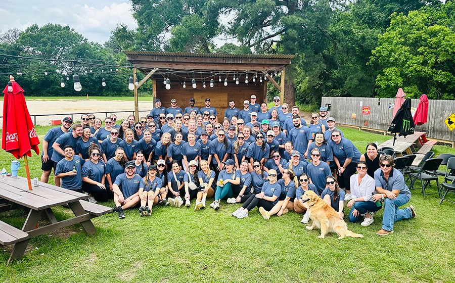 Group photograph of 2020 Texas A&amp;M University economics graduate Noelle Levantino's former coworkers at Insight Global gathered for their annual Field Day in her honor