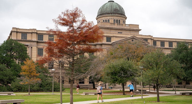 Front view of the Academic Building featuring fall foliage on the Texas A&M University campus