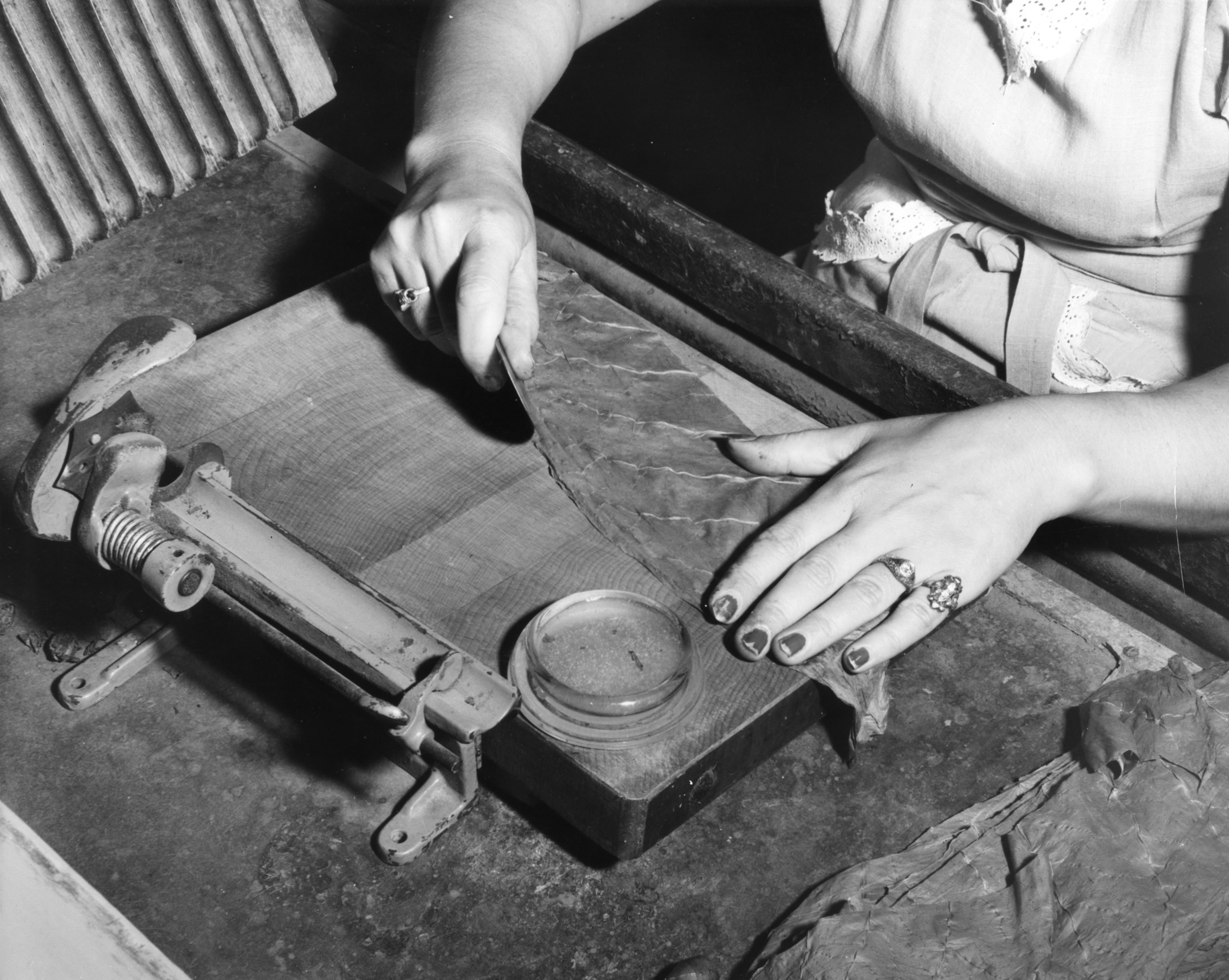 Woman rolling cigars at Cuesta Rey Factory, Circa 1950.