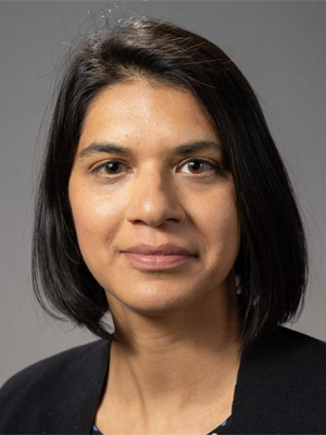 Headshot of Sarah Zubiary wearing a black sweater in front of a grey backdrop.