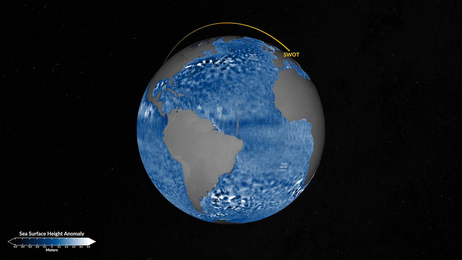 Global map depicting sea surface height anomaly recorded by the SWOT satellite, showing variations in blue tones over the Earth's oceans with the continents in gray. Yellow line marks the satellite's path.