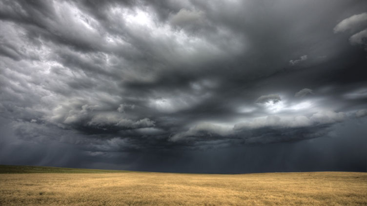 very stormy weather over an open field