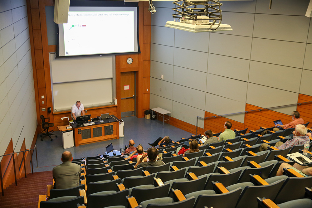 A presenter at the Low Energy Community Meeting located in the Mitchell Physics Building.