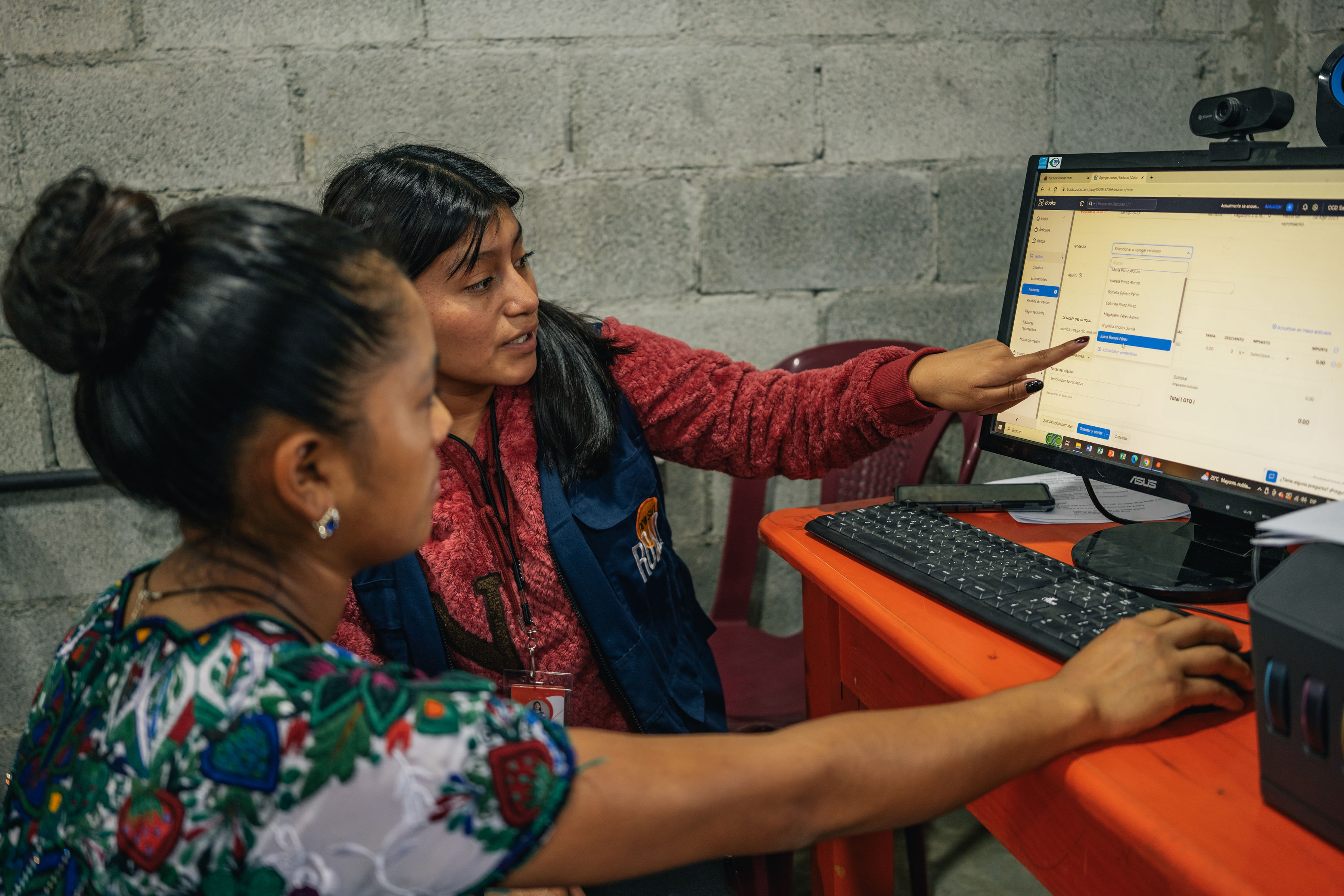 Two women learning to use computer