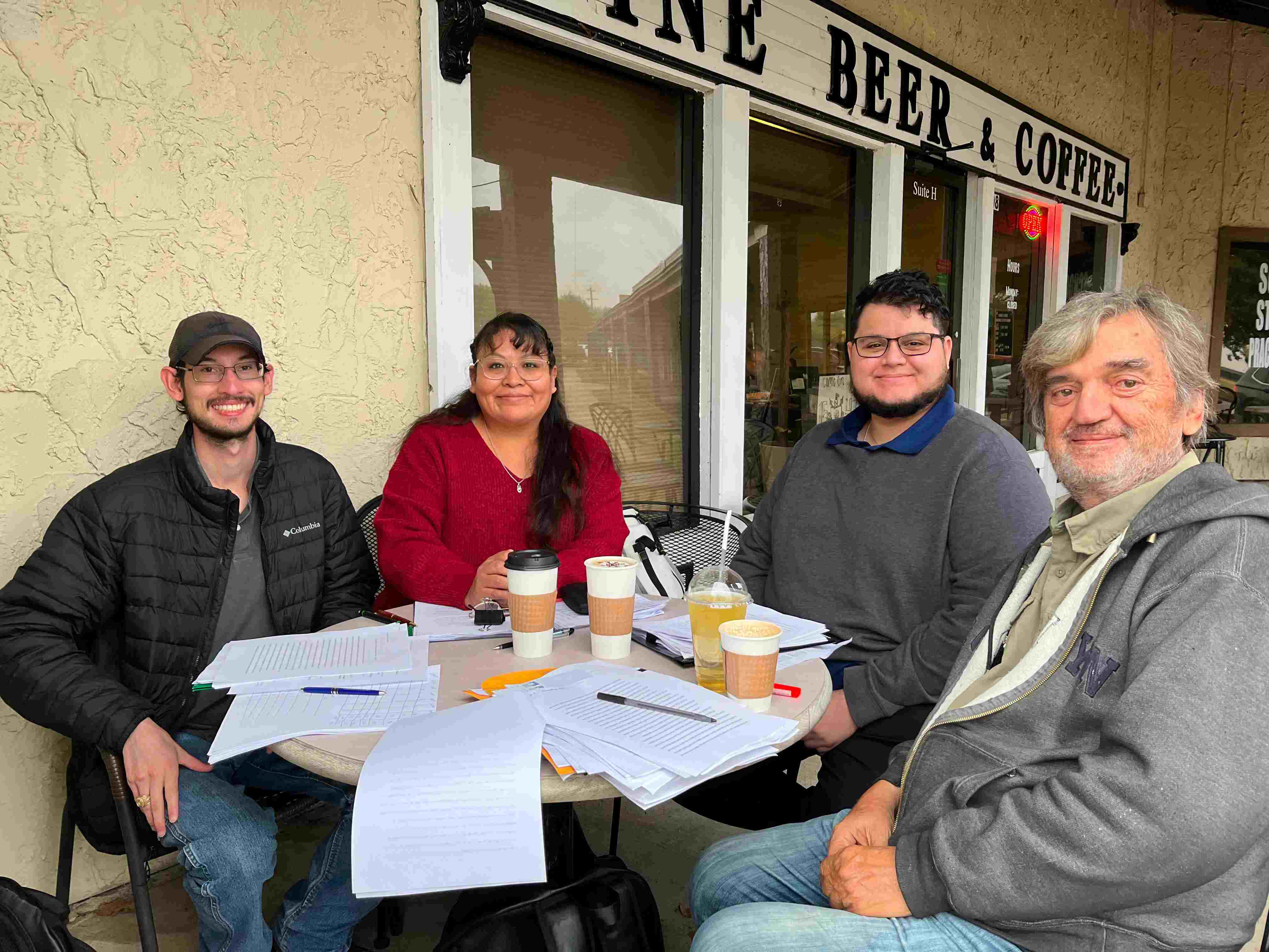 Edward Smith, Rhiannon Powers, and Juan Quiroz with Dr. Stjepan Meštrović at a coffee shop
