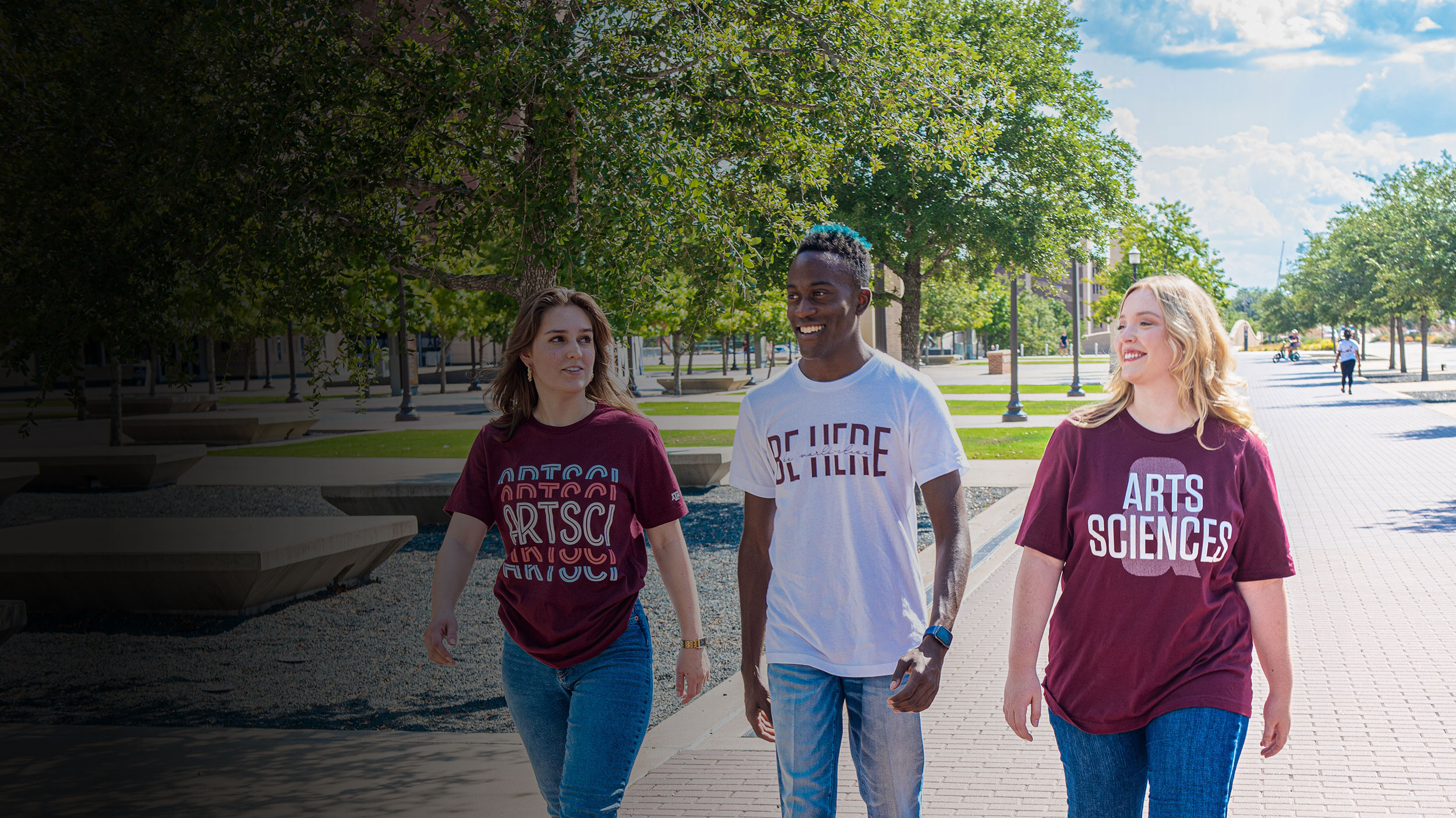 Three Arts and Sciences students walking on the Texas A&M campus.